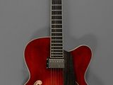 une image représentant une guitare rouge accrochée à un mur