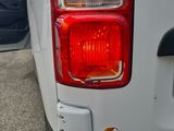 a close up of the tail lights of a white truck