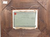 a picture of a certificate in a frame on the wall