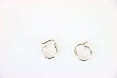 silver hoop earrings on a white background