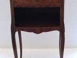 an image of a small table with a drawer on it