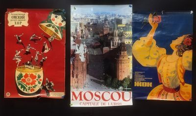 three posters of different countries are displayed on a black surface