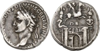 a silver coin with an image of a woman on it