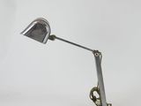 an image of a desk lamp on a rock with a white background