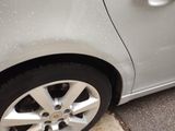 a close up of a car tire with water droplets on it