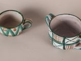 two cups sitting next to each other on a table