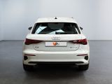 the rear end of a white audi vehicle in a white room