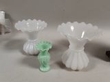 three vases sitting on a table next to each other