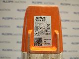 a close up of a small orange device with a sticker on it