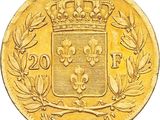 a close up of a gold coin with a crown on it