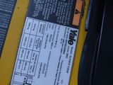a close up of a yellow machine with a label on it
