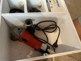 a box that has a drill and other tools inside of it