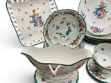 a group of plates and bowls that are sitting on a table