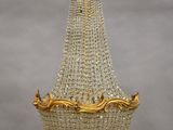 a gold and crystal chandelier hanging from a ceiling