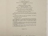 an old document with a handwritten poem on it sitting on a table