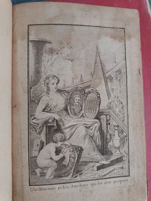 an old book with a picture of a woman and a dog on it