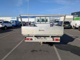 a white truck that is parked in a parking lot