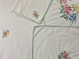 a white sheet with a bunch of flowers on it