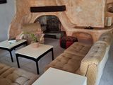 a living room with a couch and a table in it