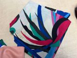a lot of different colored napkins on a table