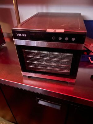 a microwave that is sitting on a red counter