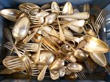 a lot of silver spoons and forks in a blue container