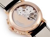 an image of a close up of a watch on a white surface