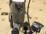 a close up of a bicycle handlebar with a badge on it