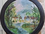une peinture à l'huile représentant un tableau d'un petit village posé sur un chevalet