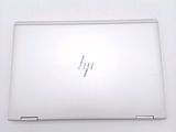 a white laptop that is sitting on a table