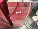 a red refrigerator sitting in the middle of a room