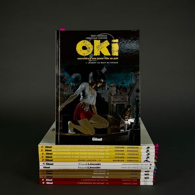 books stacked on top of each other on a black surface