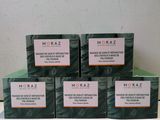 four boxes of soap sitting on top of a counter