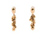 a pair of gold earrings with a teddy bear on them
