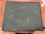 un vieux livre posé sur une table en bois, à côté d'une paire de chaussures