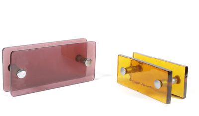 pair of pink and yellow glass door handles on a white background