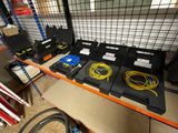 many different types of cables on a shelf in a room