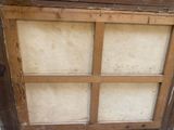 a wooden window with a glass pane in it