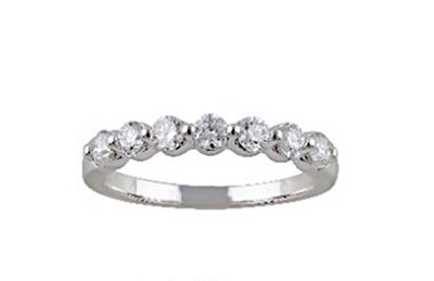 an image of a wedding ring with five diamonds on a white background