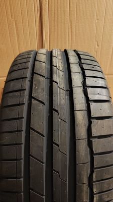 a close up of a tire on a cardboard box