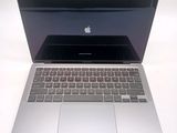 a silver laptop computer sitting on a white table