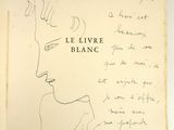 an open book with a drawing of a woman ' s face on it