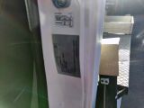 a close up of a parking meter with a sticker on it