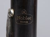 an image of a close up of a bassoon with a label on it