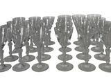 a lot of wine glasses that are sitting on the table