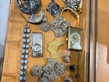 a drawer full of assorted jewelry on a table