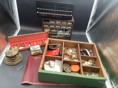 a lot of assorted items in a box on a table