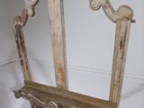 a mirror that is on a stand in a room