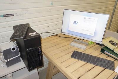 a desktop computer sitting on top of a wooden desk