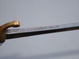 a close up of a sword with writing on it